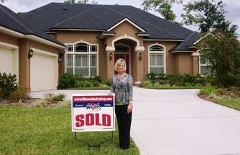 teresa-with-sold-sign-350.jpg (14,692 bytes)
